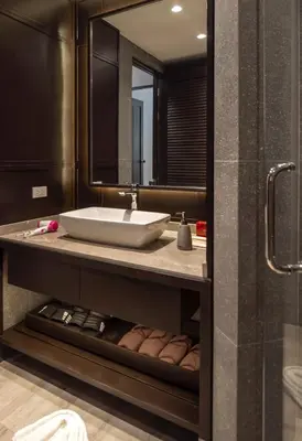 a bathroom with a sink and a mirror at The Pe La Resort, Phuket - SHA Extra Plus in Kamala Beach