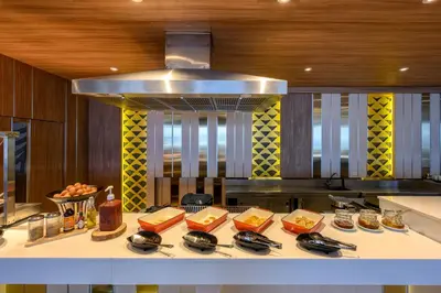 a kitchen with a counter with food on it at Namaka Resort Kamala in Kamala Beach