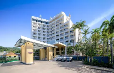 a large hotel with a parking lot in front of it at Centara Karon Resort Phuket in Karon Beach