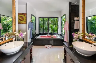 a bathroom with two sinks and a red tub at The Bell Pool Villa Resort Phuket in Kamala Beach