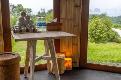 a table in a room next to a window at Koyao Island Resort in Ko Yao Noi