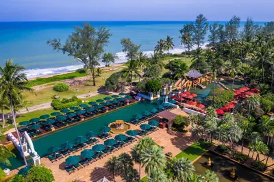 an aerial view of a resort with a pool and the ocean at JW Marriott Phuket Resort and Spa in Mai Khao Beach