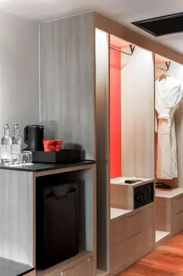 a kitchen with a counter with a stove at Radisson RED Phuket Patong Beach in Patong Beach