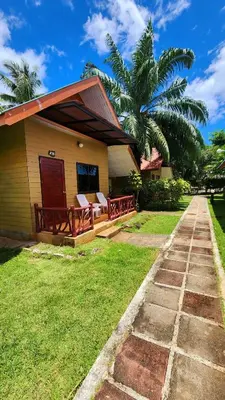 a house with two chairs and a porch at Mild Garden View Resort in Ao Nang Beach
