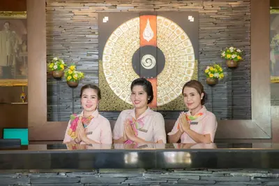 a group of three women standing in a pool at Karona Resort & Spa - SHA Extra Plus in Karon Beach