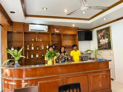 a group of people standing at a bar at Patong Lamai Residence in Patong Beach