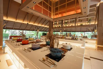 a large room with a table with potted plants on it at Villa Zolitude Resort & Spa - SHA Extra Plus in Chalong