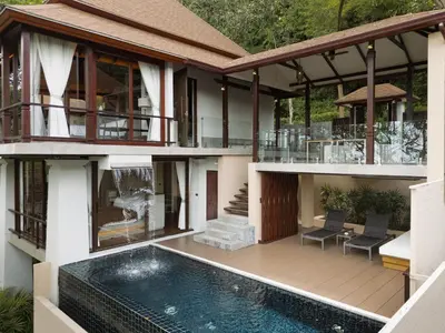 an external view of a house with a swimming pool at Villa Zolitude Resort & Spa - SHA Extra Plus in Chalong