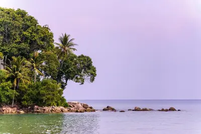 an island in the ocean with trees and water at Seaview Patong Hotel - SHA Plus in Patong Beach