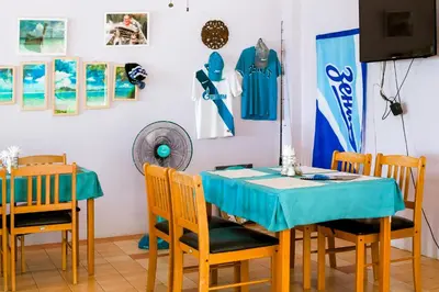 a dining room with a table and chairs at Klong Muang Sunset House in Klong Muang Beach