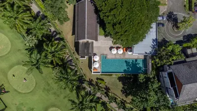 an overhead view of a yard with a swimming pool at Tinidee Golf Resort Phuket in Kathu