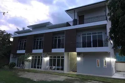 a rendering of a house at night at Snooze Inn Phuket - Free Shuttle to Bang Rong Pier in Ban Pa Khlok