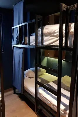 a group of bunk beds in a room at Borbaboom Phuket Poshtel & Hostel in Phuket Town