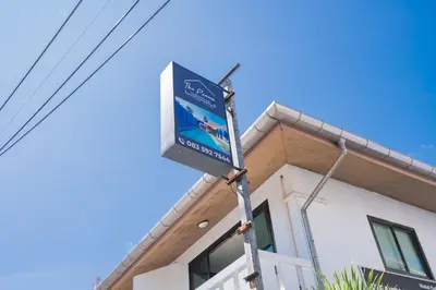 a sign in front of a building at The Panwa Guesthouse, Phuket in Panwa Beach