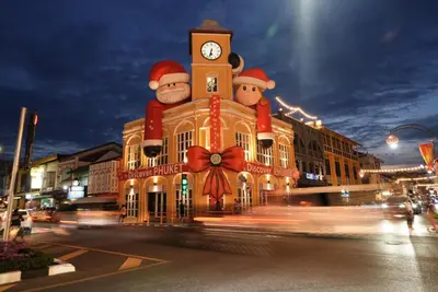a building with santa claus on top of it at Book a Bed Poshtel - SHA Plus in Phuket Town