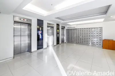 an empty lobby with elevators in a building at Patong Tower Amazing Sea View 12 by PHR in Patong Beach