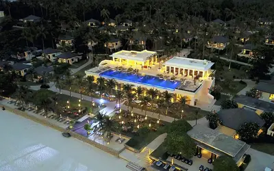 an aerial view of a resort at night at The Racha in Ko Racha Yai