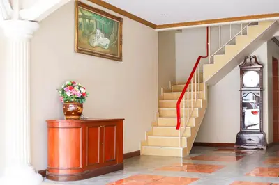 a staircase in a house with a red ribbon at Tony Resort in Patong Beach