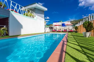 a swimming pool in the yard of a house at PJ Patong Resortel in Patong Beach