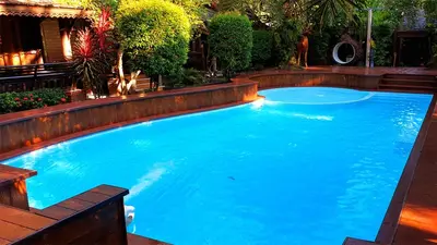a large pool with blue water in a yard at Baan Habeebee Resort in Ao Nang Beach