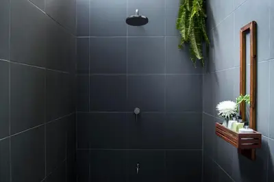 a bathroom with a shower with blue tiles at Krabi Home Resort in Tab Kaek Beach