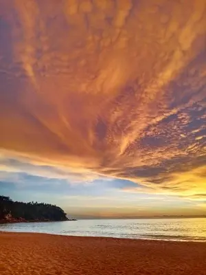 a view of a beach with a cloudy sky at Phuket Green Home in Karon Beach
