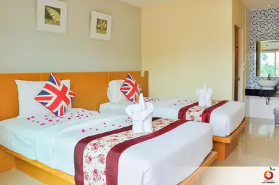 two beds in a hotel room with british flags on them at The Orange City Resort in Ao Nang Beach