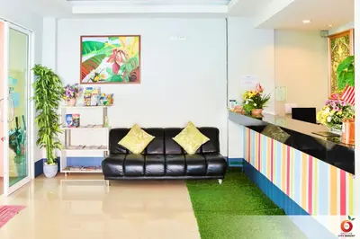 a black leather couch in a waiting room at The Orange City Resort in Ao Nang Beach