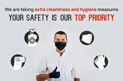 a man wearing a black face mask with the words we are taking extra cleanliness at Maikhao Beach Residence in Mai Khao Beach