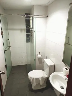 a bathroom with a toilet and a shower and a sink at Sea Beach Paradise in Patong Beach