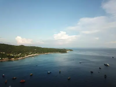 an aerial view of a large body of water with boats at Natacha Hotel in Phi Phi Don