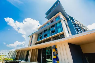 a building with a sign on top of it at 1-BR Sea View, Aristo condo, Surin Beach in Surin Beach