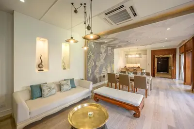 a living room with a couch and a table at Maikhao Dream Villa Resort and Spa, Maikhao Phuket in Mai Khao Beach