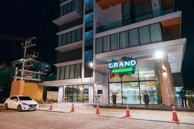 a car parked in front of a building with a dealership at Grand Kata VIP - Kata Beach in Kata Beach