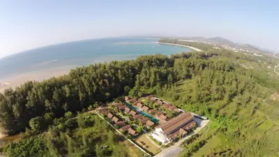 an aerial view of a resort next to a body of water at L'esprit De Naiyang Beach Resort - SHA Extra Plus in Nai Yang Beach