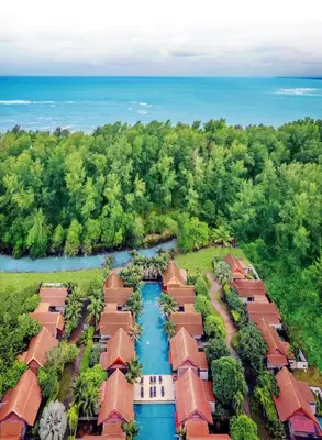 an aerial view of a resort with a river at L'esprit De Naiyang Beach Resort - SHA Extra Plus in Nai Yang Beach