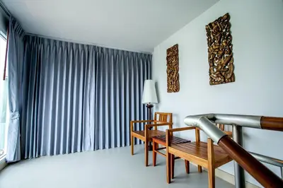 a room with two chairs and a table and a window at Phi Phi Harbour View Hotel in Phi Phi Don