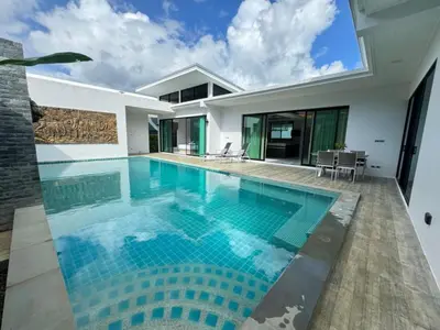 a swimming pool in the backyard of a house at Skypool Villa by G Estate Phuket in Nai Harn Beach