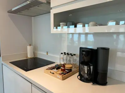 a kitchen with a coffee maker on a counter at Villa Tantawan Resort - Private Pool Villas in Kamala Beach