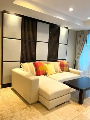 a living room with a couch and a table at Bel Air Cape Panwa Resort Phuket in Panwa Beach
