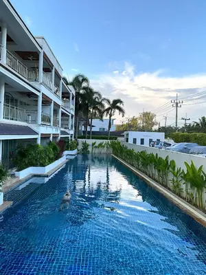 a swimming pool in the middle of a building at Bel Air Cape Panwa Resort Phuket in Panwa Beach