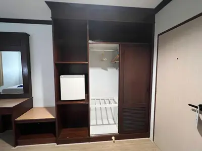 an empty cabinet in a room with a mirror at Keep Aonang in Ao Nang Beach
