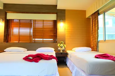 two beds in a room with red robes on them at Aonang Top View in Ao Nang Beach
