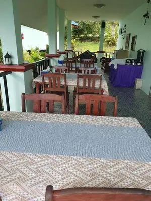 a room with a table and chairs and a room with a table at Groovy Bungalows in Ao Nang Beach