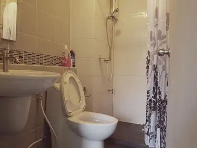 a bathroom with a toilet and a sink at Dcondo Kathu Patong Phuket by Suna in Kathu