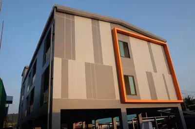 a building with an orange window on the side of it at DOS'S HOUSE in Nai Yang Beach