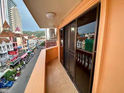 a balcony with a view of a city street at Star Guesthouse in Patong Beach