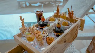 a tray of appetizers and drinks on a table at Sea Seeker Krabi Resort in Ao Nang Beach