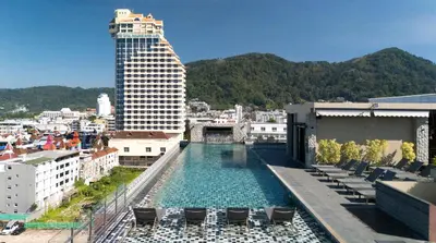 a swimming pool on the roof of a building at Gu Hotel Patong in Patong Beach