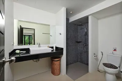 a bathroom with a sink and a toilet and a shower at VILLA Emauha Pool Thaimond Residence Naiharn in Rawai Beach